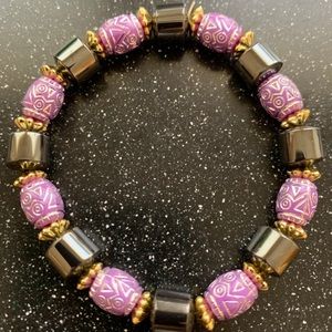 Black, purple, gold bracelet